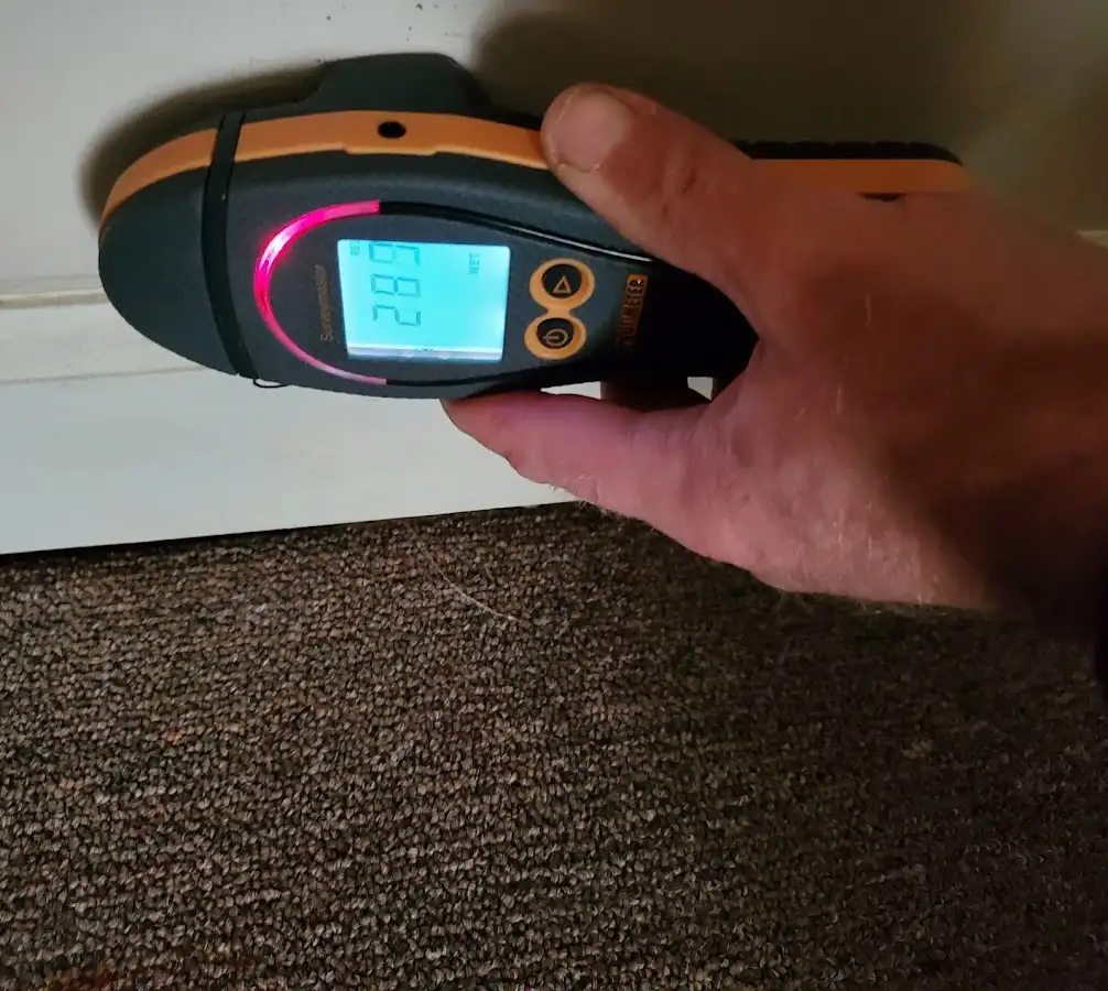 Moisture detection at baseboard during Storm Damage Restoration in Aiken